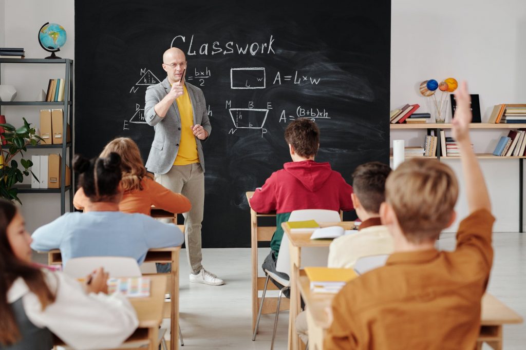 A teacher teaching his class